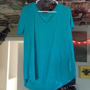 teal v-neck t shirt. navy poncho